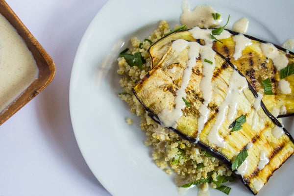 GRILLED EGGPLANT WITH HERBED QUINOA & CUMIN TAHINI DRESSING